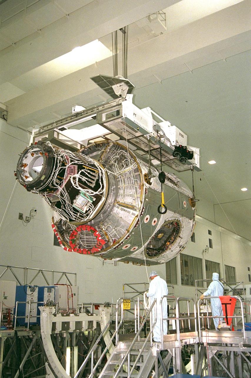 KENNEDY SPACE CENTER, FLA. -- Node 1, the first U.S. element for the International Space Station, and Pressurized Mating Adapter-1 (PMA-1) continue with prelaunch preparation activities at KSC's Space Station Processing Facility. Node 1 is a connecting passageway to the living and working areas of the space station. The node and PMA-1 are being hoisted from their workstand and moved to an element rotation stand, or test stand, where they will undergo an interim weight and center of gravity determination. The final determination is planned to be performed prior to transporting Node 1 to the launch pad. Node 1 is scheduled to fly on STS-88