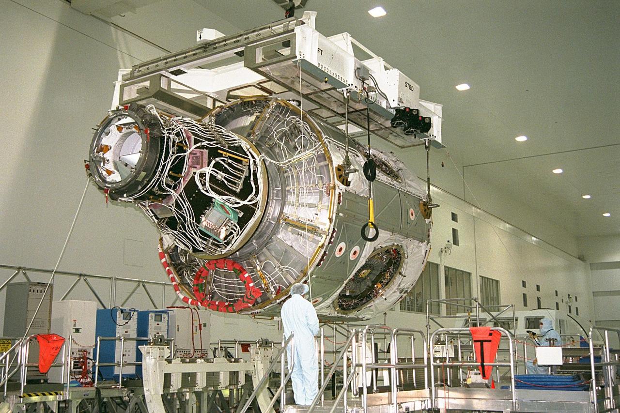 KENNEDY SPACE CENTER, FLA. -- Node 1, the first U.S. element for the International Space Station, and Pressurized Mating Adapter-1 (PMA-1) continue with prelaunch preparation activities at KSC's Space Station Processing Facility. Node 1 is a connecting passageway to the living and working areas of the space station. The node and PMA-1 are being hoisted from their workstand and moved to an element rotation stand, or test stand, where they will undergo an interim weight and center of gravity determination. The final determination is planned to be performed prior to transporting Node 1 to the launch pad. Node 1 is scheduled to fly on STS-88