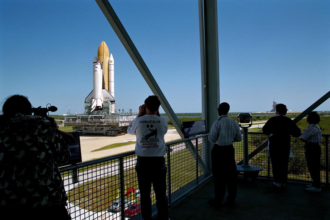 KENNEDY SPACE CENTER, FLA. -- The Space Shuttle Columbia continues its morning rollout past the newly opened tour stop, the Launch Complex 39 Observation Gantry, to Launch Pad 39B in preparation for the STS-90 mission. The Neurolab experiments are the primary payload on this nearly 17-day space flight. Investigations during the Neurolab mission will focus on the effects of microgravity on the nervous system. Specifically, experiments will study the adaptation of the vestibular system, the central nervous system, and the pathways that control the ability to sense location in the absence of gravity, as well as the effect of microgravity on a developing nervous system. The crew of STS-90, slated for launch April 16 at 2:19 p.m. EDT, includes Commander Richard Searfoss, Pilot Scott Altman, Mission Specialists Richard Linnehan, Dafydd (Dave) Williams, M.D., and Kathryn (Kay) Hire, and Payload Specialists Jay Buckey, M.D., and James Pawelczyk, Ph.D