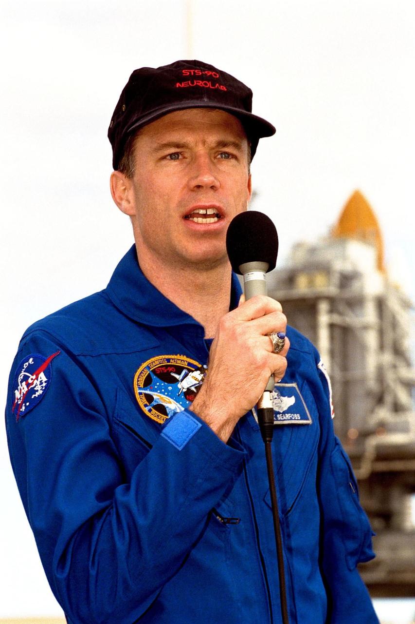 STS-90 Commander Richard Searfoss addresses the media at KSC's Launch Pad 39B, where the crew are participating in Terminal Countdown Demonstration Test (TCDT) activities. The TCDT is held at KSC prior to each Space Shuttle flight to provide crews with the opportunity to participate in simulated countdown activities. Columbia is targeted for launch of STS-90 on April 16 at 2:19 p.m. EDT and will be the second mission of 1998. The mission is scheduled to last nearly 17 days