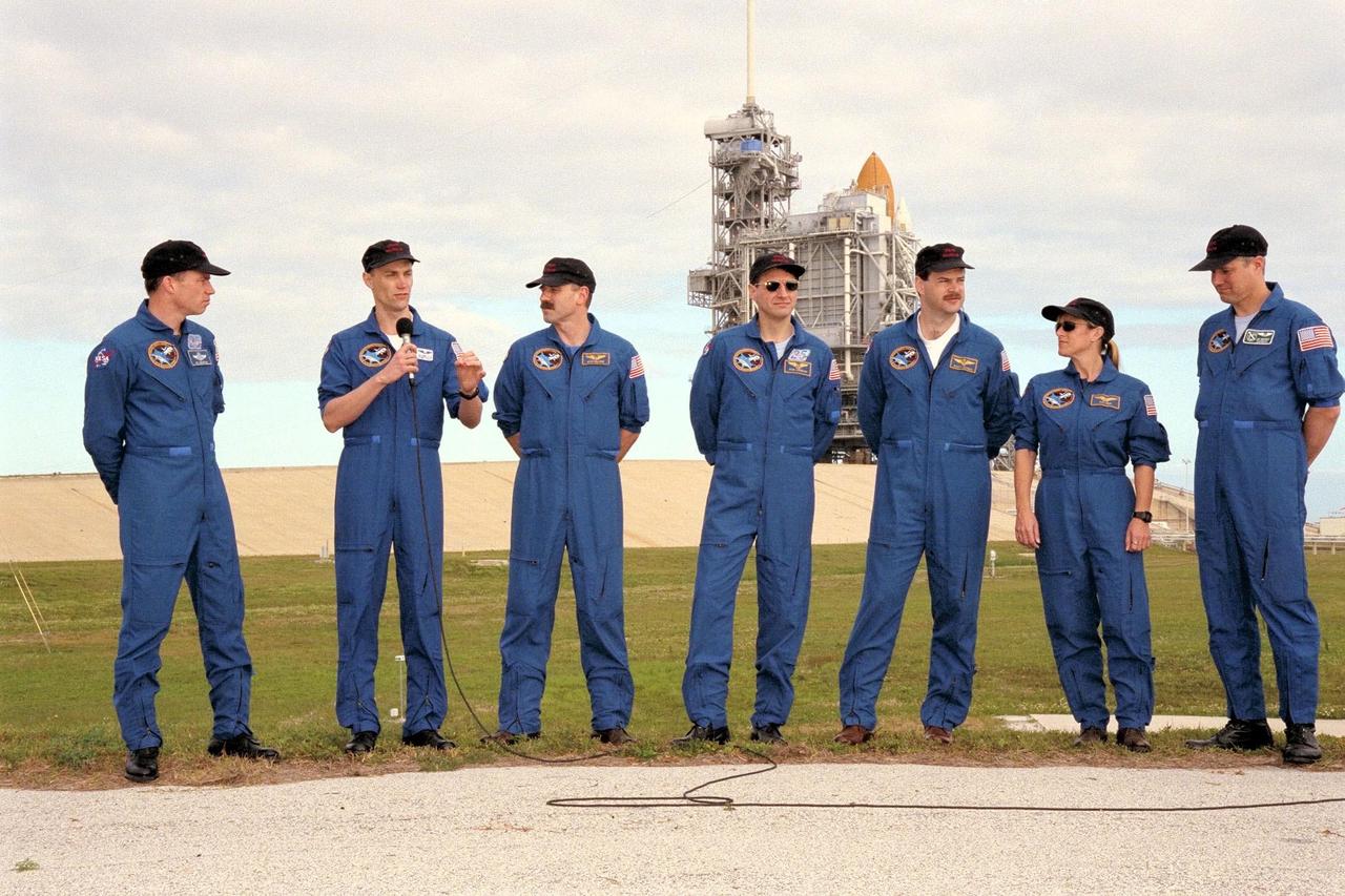 The crew of STS-90 participate in Terminal Countdown Demonstration Test (TCDT) activities at KSC's Launch Pad 39B. The TCDT is held at KSC prior to each Space Shuttle flight to provide crews with the opportunity to participate in simulated countdown activities. The crew include, left to right, Commander Richard Searfoss, Payload Specialist James Pawelczyk, Ph.D., Mission Specialist Dafydd (Dave) Williams, M.D., with the Canadian Space Agency, Mission Specialist Richard Linnehan, D.V.M., Pilot Scott Altman, Mission Specialist Kathryn (Kay) Hire, and Payload Specialist Jay Buckey, M.D. Columbia is targeted for launch of STS-90 on April 16 at 2:19 p.m. EDT and will be the second mission of 1998. The mission is scheduled to last nearly 17 days