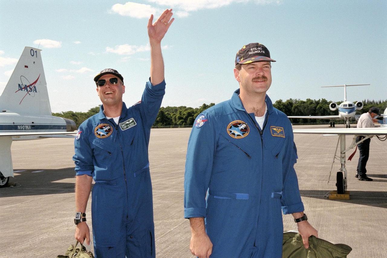 KENNEDY SPACE CENTER, FLA. -- STS-90 Payload Specialist Jay Buckey, M.D. (at left), and Pilot Scott Altman arrive at Kennedy Space Center's Shuttle Landing Facility in preparation for the launch of Columbia on April 16 at 2:19 p.m. EDT from KSC's Launch Pad 39B. The launch of Neurolab on STS-90, which will be the second mission of 1998, is scheduled to last nearly 17 days