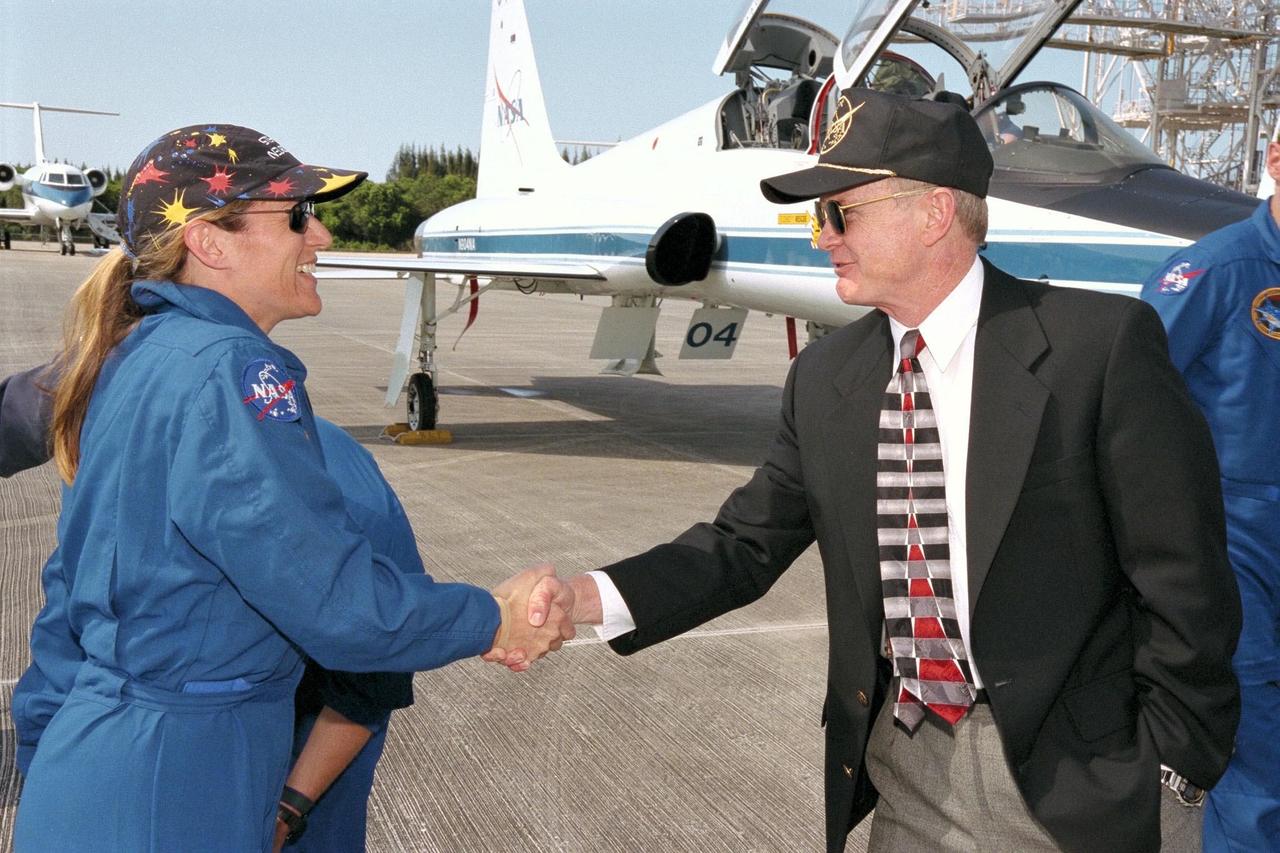 KENNEDY SPACE CENTER, FLA. -- Center Director Roy Bridges greets STS-90 Mission Specialist Kathryn (Kay) Hire shortly after her arrival at Kennedy Space Center's Shuttle Landing Facility in preparation for the launch of Columbia on April 16 at 2:19 p.m. EDT from KSC's Launch Pad 39B. The flight of Neurolab on STS-90, which will be the second mission of 1998, is scheduled to last nearly 17 days.