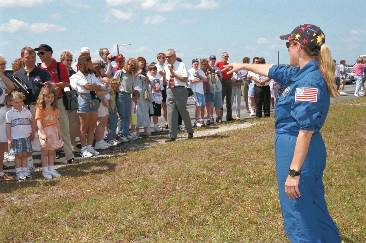 KENNEDY SPACE CENTER, FLA. -- STS-90 Mission Specialist Kathryn (Kay) Hire waves to friends and family members near Launch Pad 39B, from which she and the rest of the seven-member crew are scheduled to launch aboard Columbia on May 16 at 2:19 p.m. EDT. The astronauts are under strict health stabilization guidelines to protect them from close contact with persons who do not have health stabilization clearance. This is the 25th flight of Columbia and the 90th mission flown since the start of the Space Shuttle program. STS-90 is a nearly 17-day life sciences research flight that will focus on the most complex and least understood part of the human body the nervous system. Neurolab will examine the effects of spaceflight on the brain, spinal cord, peripheral nerves and sensory organs in the human body