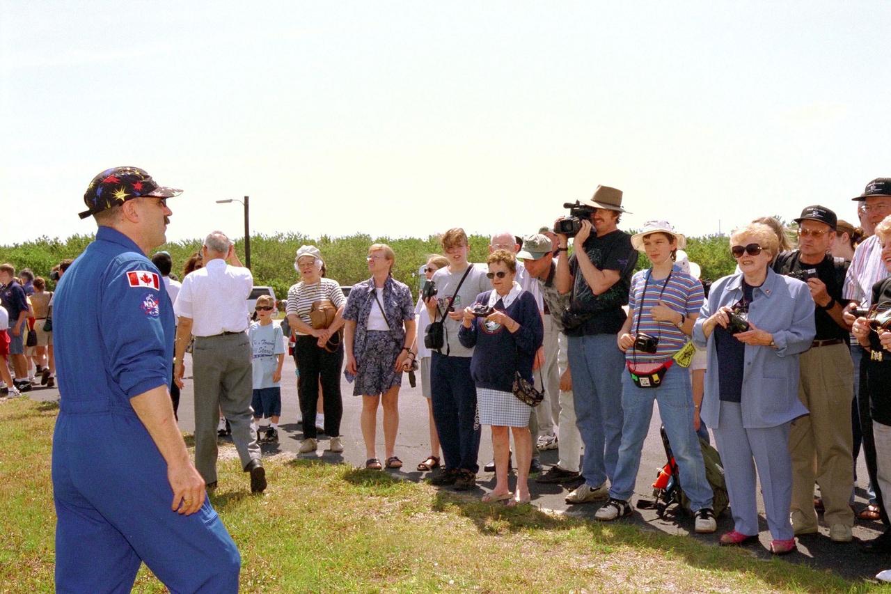 KENNEDY SPACE CENTER, FLA. -- STS-90 Mission Specialist Dafydd (Dave) Williams, M.D., with the Canadian Space Agency speaks with friends and family members near Launch Pad 39B, from which he and the rest of the seven-member crew are scheduled to launch aboard Columbia on May 16 at 2:19 p.m. EDT. The astronauts are under strict health stabilization guidelines to protect them from close contact with persons who do not have health stabilization clearance. This is the 25th flight of Columbia and the 90th mission flown since the start of the Space Shuttle program. STS-90 is a nearly 17-day life sciences research flight that will focus on the most complex and least understood part of the human body the nervous system. Neurolab will examine the effects of spaceflight on the brain, spinal cord, peripheral nerves and sensory organs in the human body