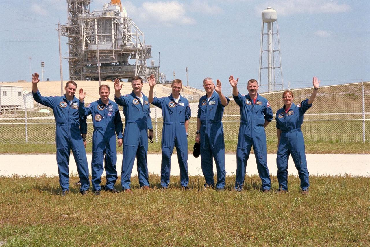 KENNEDY SPACE CENTER, FLA. -- The STS-90 crew wave to friends and family members near Launch Pad 39B, from which they are scheduled to launch aboard Columbia on May 16 at 2:19 p.m. EDT. The crew include, left to right, Mission Specialist Richard Linnehan, D.V.M., Commander Richard Searfoss, Pilot Scott Altman, Payload Specialists James Pawelczyk, Ph.D., and Jay Buckey, M.D., and Mission Specialists Dafydd (Dave) Williams, M.D., with the Canadian Space Agency, and Kathryn (Kay) Hire. The Space Shuttle Columbia is seen in the background, protected by its Rotating Service Structure. This is the 25th flight of Columbia and the 90th mission flown since the start of the Space Shuttle program. STS-90 is a nearly 17-day life sciences research flight that will focus on the most complex and least understood part of the human body the nervous system. Neurolab will examine the effects of spaceflight on the brain, spinal cord, peripheral nerves and sensory organs in the human body