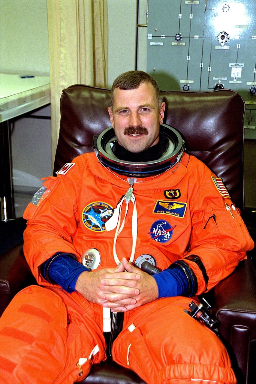 KENNEDY SPACE CENTER, FLA. -- STS-90 Mission Specialist Dafydd (Dave) Williams, M.D., with the Canadian Space Agency sits in a chair during suitup activities in the Operations and Checkout Building. Williams and the rest of the STS-90 crew will shortly depart for Launch Pad 39B, where the Space Shuttle Columbia awaits a second liftoff attempt at 2:19 p.m. EDT. His first trip into space, Williams is participating in this life sciences research flight that will focus on the most complex and least understood part of the human body the nervous system. Neurolab will examine the effects of spaceflight on the brain, spinal cord, peripheral nerves and sensory organs in the human body