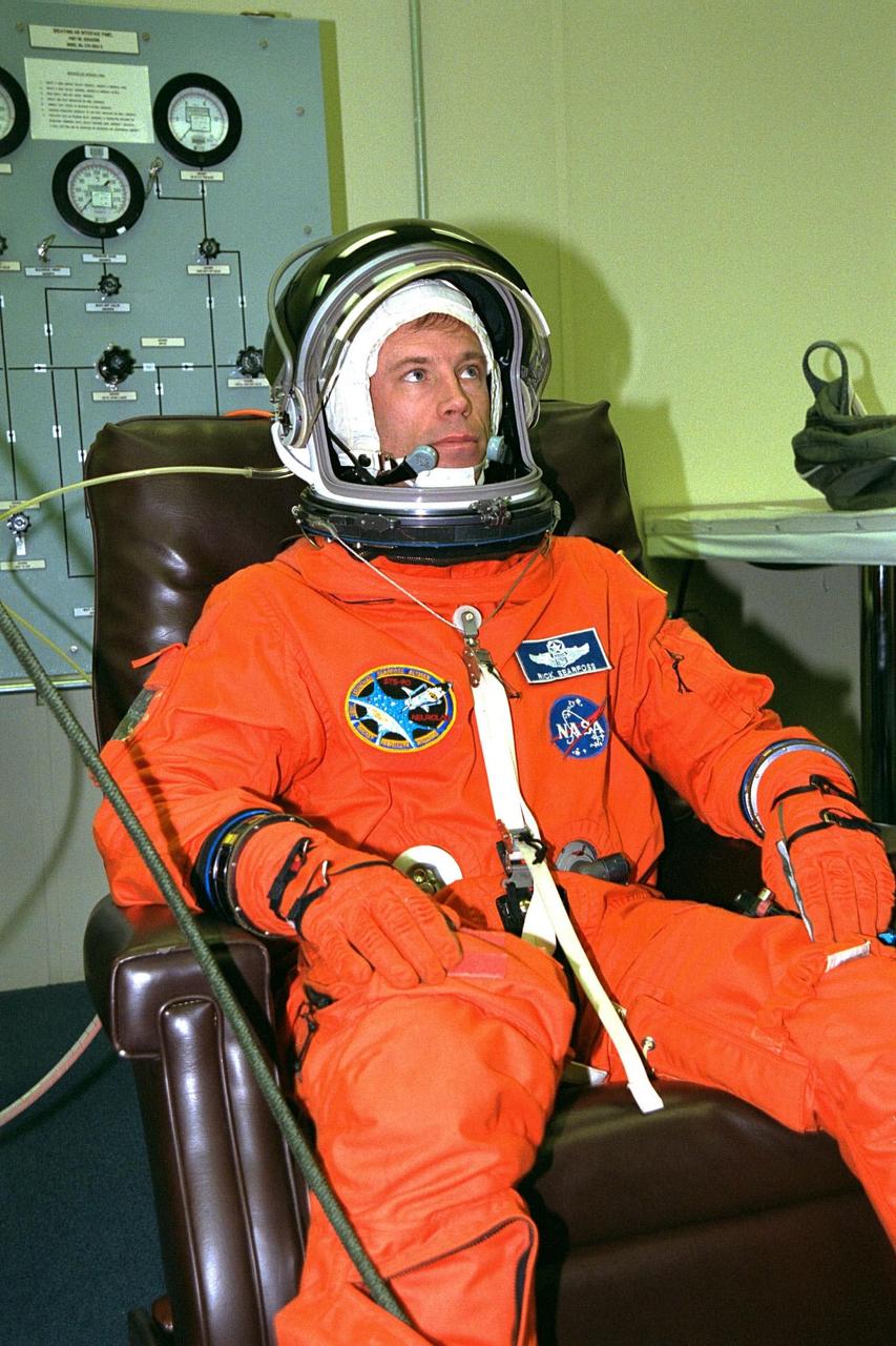 STS-90 Mission Commander Richard Searfoss sits in a chair during suitup activities in the Operations and Checkout Building. Searfoss and the rest of his flight crew will shortly depart for Launch Pad 39B, where the Space Shuttle Columbia awaits a second liftoff attempt at 2:19 p.m. EDT. His third trip into space, Searfoss commands this life sciences research flight that will focus on the most complex and least understood part of the human body the nervous system. Neurolab will examine the effects of spaceflight on the brain, spinal cord, peripheral nerves and sensory organs in the human body