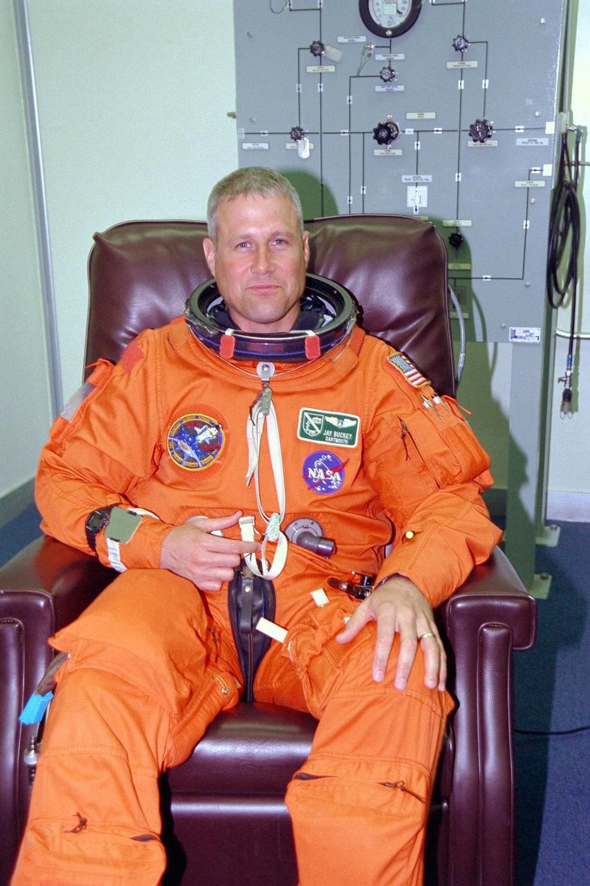 STS-90 Payload Specialist Jay Buckey, M.D., prepares for launch during suit-up activities in KSC's Operations and Checkout Building. Buckey and the rest of the STS-90 crew will shortly depart for Launch Pad 39B, where the Space Shuttle Columbia awaits a second liftoff attempt at 2:19 p.m. EDT. His first trip into space, Buckey is participating in a life sciences research flight that will focus on the most complex and least understood part of the human body the nervous system. Neurolab will examine the effects of spaceflight on the brain, spinal cord, peripheral nerves and sensory organs in the human body