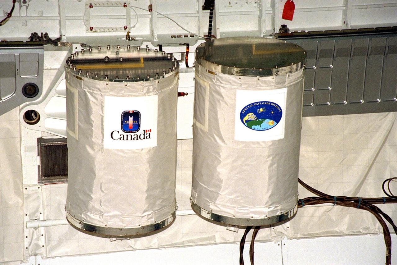 Processing activities for STS-91 continue in KSC's Orbiter Processing Facility Bay 2. Two Get Away Special (GAS) canisters are shown after their installation into Discovery's payload bay. At left is G-648, an Canadian Space Agency-sponsored study of manufactured organic thin film by the physical vapor transport method, and the can on the right contains commemorative flags to be flown during the mission. STS-91 is scheduled to launch aboard the Space Shuttle Discovery for the ninth and final docking with the Russian Space Station Mir from KSC's Launch Pad 39A on June 2 with a launch window opening around 6:04 p.m. EDT