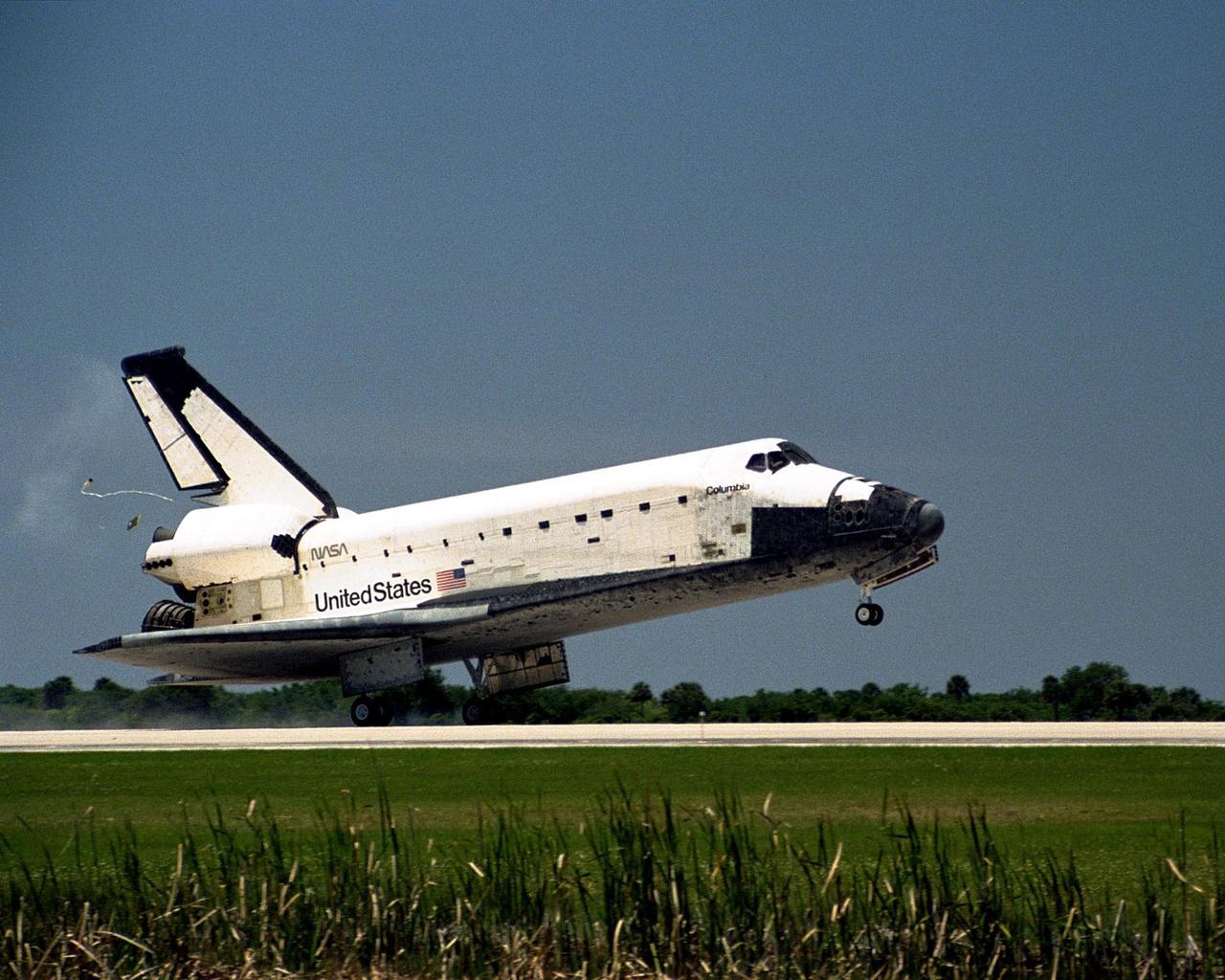 The orbiter Columbia touches down on Runway 33 of KSC's Shuttle Landing Facility to complete the nearly 16-day STS-90 mission. Main gear touchdown was at 12:08:59 p.m. EDT on May 3, 1998, landing on orbit 256 of the mission. The wheels stopped at 12:09:58 EDT, completing a total mission time of 15 days, 21 hours, 50 minutes and 58 seconds. The 90th Shuttle mission was Columbia's 13th landing at the space center and the 43rd KSC landing in the history of the Space Shuttle program. During the mission, the crew conducted research to contribute to a better understanding of the human nervous system. The crew of the STS-90 Neurolab mission include Commander Richard Searfoss; Pilot Scott Altman; Mission Specialists Richard Linnehan, D.V.M., Dafydd (Dave) Williams, M.D., with the Canadian Space Agency, and Kathryn (Kay) Hire; and Payload Specialists Jay Buckey, M.D., and James Pawelczyk, Ph.D