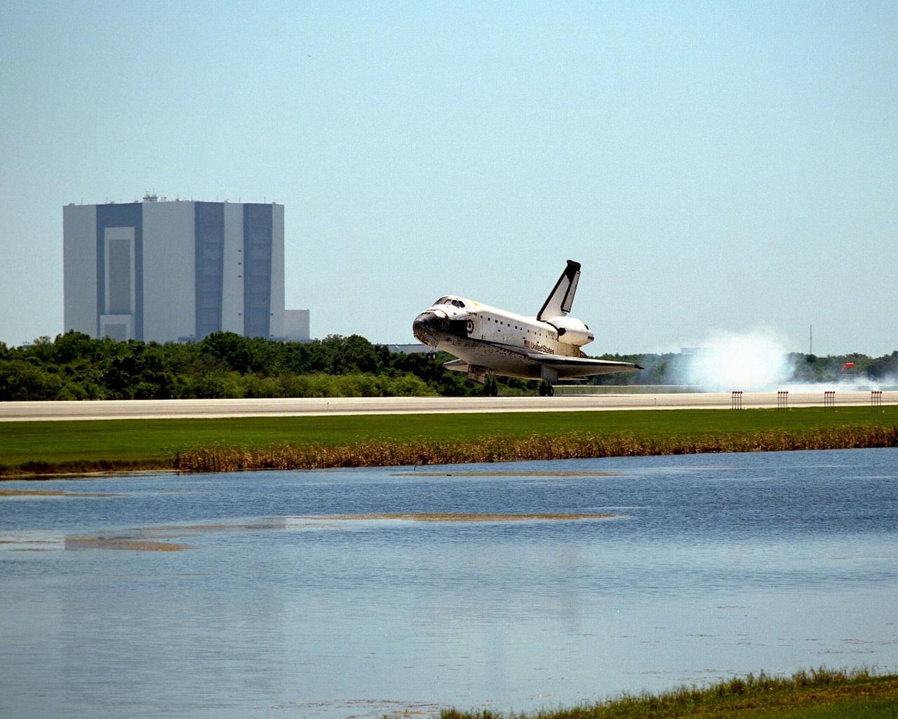 The orbiter Columbia touches down on Runway 33 of KSC's Shuttle Landing Facility to complete the nearly 16-day STS-90 mission. Main gear touchdown was at 12:08:59 p.m. EDT on May 3, 1998, landing on orbit 256 of the mission. The wheels stopped at 12:09:58 EDT, completing a total mission time of 15 days, 21 hours, 50 minutes and 58 seconds. The 90th Shuttle mission was Columbia's 13th landing at the space center and the 43rd KSC landing in the history of the Space Shuttle program. During the mission, the crew conducted research to contribute to a better understanding of the human nervous system. The crew of the STS-90 Neurolab mission include Commander Richard Searfoss; Pilot Scott Altman; Mission Specialists Richard Linnehan, D.V.M., Dafydd (Dave) Williams, M.D., with the Canadian Space Agency, and Kathryn (Kay) Hire; and Payload Specialists Jay Buckey, M.D., and James Pawelczyk, Ph.D