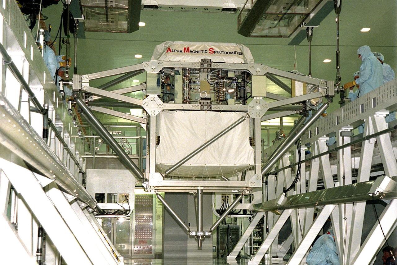 Under the supervision of Boeing technicians, the Alpha Magnetic Spectrometer (AMS), a payload slated to fly on STS-91, is undergoing a final weight and balance check on the Launch Package Integration Stand in the Space Station Processing Facility (SSPF). Next, it will be placed in the Payload Canister and transported to Launch Complex 39A where it will be installed into Space Shuttle Discovery's payload bay. Weighing in at approximately three tons, the AMS is a major particle physics experiment that will look for cosmic antimatter originating from outside our galaxy. The data it gathers could also give clues about the mysterious "dark matter" that may make up 90 percent or more of the universe. STS-91 is scheduled to be launched on June 2 with a launch window opening around 6:10 p.m. EDT. The mission will also feature the ninth Shuttle docking with the Russian Space Station Mir, the first Mir docking for Discovery, and the conclusion of Phase I of the joint U.S.-Russian International Space Station Program. The STS-91 flight crew includes Commander Charles Precourt; Pilot Dominic Gorie; and Mission Specialists Wendy B. Lawrence; Franklin Chang-Diaz, Ph.D.; Janet Kavandi, Ph.D.; and Valery Ryumin, with the Russian Space Agency. Andrew Thomas, Ph.D., will be returning to Earth with the crew after living more than four months aboard Mir