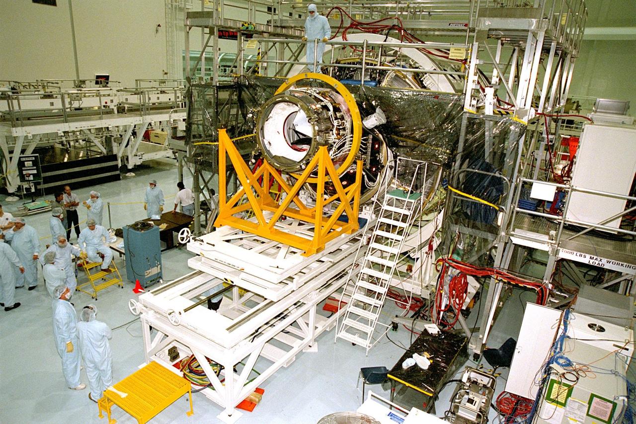 Pressurized Mating Adapter (PMA)-2 is in the process of being mated to Node 1 of the International Space Station (ISS) under the supervision of Boeing technicians in KSC's Space Station Processing Facility (SSPF). The node is the first element of the ISS to be manufactured in the United States and is currently scheduled to lift off aboard the Space Shuttle Endeavour on STS-88 later this year, along with PMAs 1 and 2. This PMA is a cone-shaped connector to Node 1, which will have two PMAs attached once this mate is completed. Once in space, Node 1 will function as a connecting passageway to the living and working areas of the ISS. It has six hatches that will serve as docking ports to the U.S. laboratory module, U.S. habitation module, an airlock and other space station elements