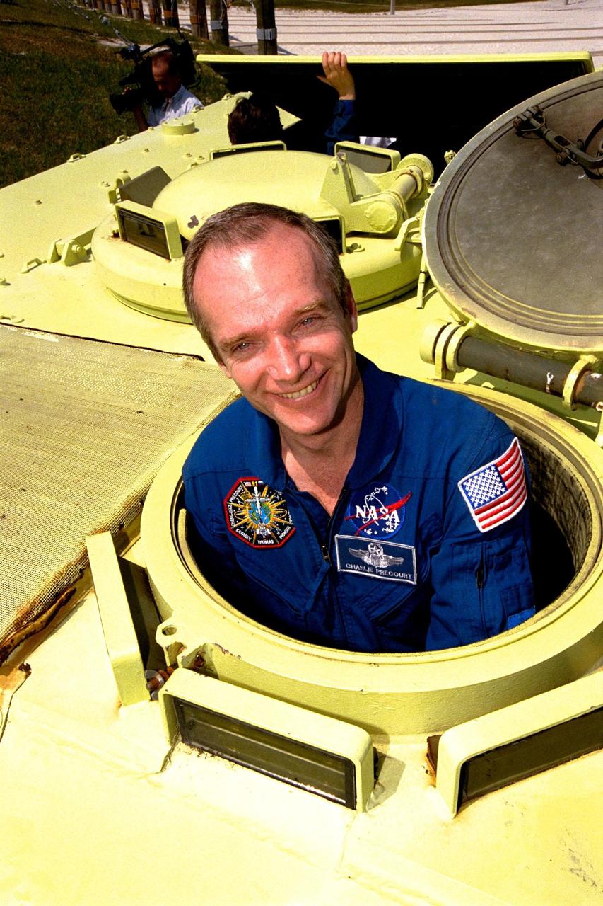 STS-91 Mission Commander Charles Precourt is learning how to operate an M-113 armored personnel carrier during Terminal Countdown Demonstration Test (TCDT) training activities. The TCDT is held at KSC prior to each Space Shuttle flight to provide crews with an opportunity to participate in simulated countdown activities. STS-91 is scheduled to be launched on June 2 with a launch window opening around 6:10 p.m. EDT. The mission will feature the ninth Shuttle docking with the Russian Space Station Mir, the first Mir docking for Discovery, the conclusion of Phase I of the joint U.S.-Russian International Space Station Program, and the first flight of the new Space Shuttle super lightweight external tank. The STS-91 flight crew also includes Pilot Dominic Gorie and Mission Specialists Wendy B. Lawrence; Franklin Chang-Diaz, Ph.D.; Janet Kavandi, Ph.D.; and Valery Ryumin, with the Russian Space Agency. Andrew Thomas, Ph.D., will be returning to Earth with the crew after living more than four months aboard Mir
