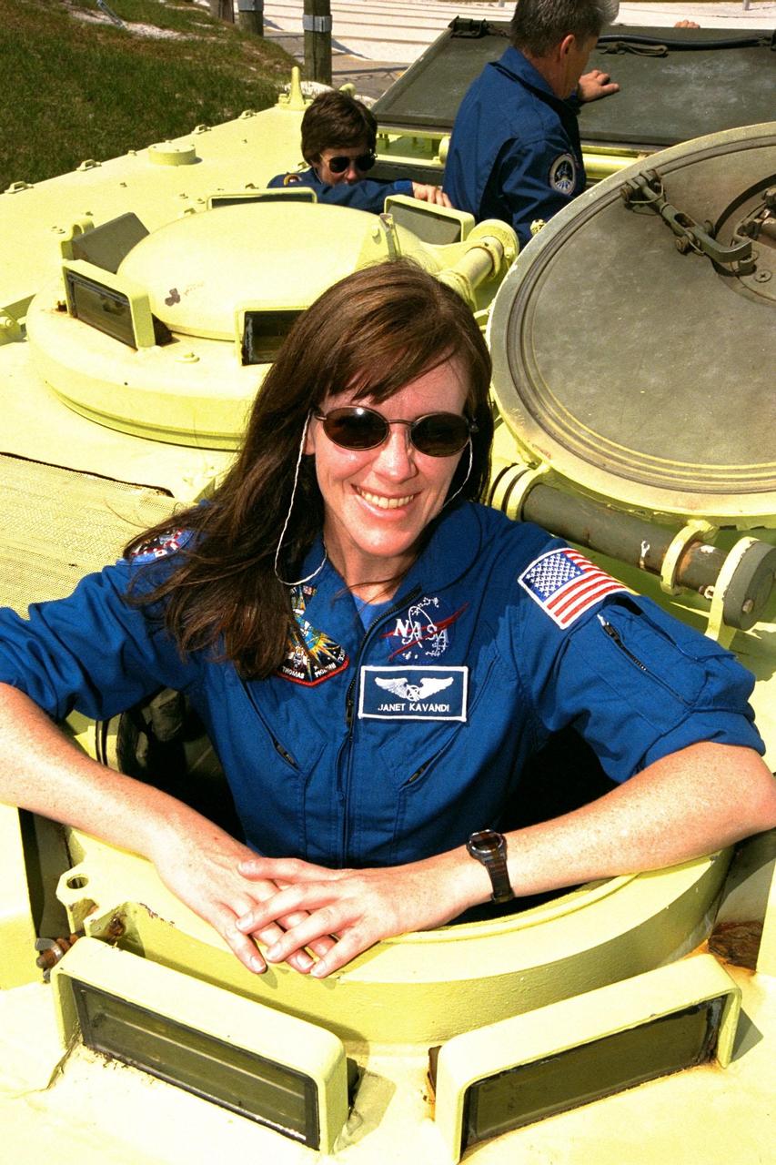 STS-91 Mission Specialist Janet Kavandi, Ph.D., is learning how to operate an M-113 armored personnel carrier during Terminal Countdown Demonstration Test (TCDT) training activities. The TCDT is held at KSC prior to each Space Shuttle flight to provide crews with an opportunity to participate in simulated countdown activities. STS-91 is scheduled to be launched on June 2 with a launch window opening around 6:10 p.m. EDT. The mission will feature the ninth Shuttle docking with the Russian Space Station Mir, the first Mir docking for Discovery, the conclusion of Phase I of the joint U.S.-Russian International Space Station Program, and the first flight of the new Space Shuttle super lightweight external tank. The STS-91 flight crew also includes Commander Charles Precourt; Pilot Dominic Gorie; and Mission Specialists Wendy B. Lawrence; Franklin Chang-Diaz, Ph.D.; and Valery Ryumin, with the Russian Space Agency. Andrew Thomas, Ph.D., will be returning to Earth with the crew after living more than four months aboard Mir