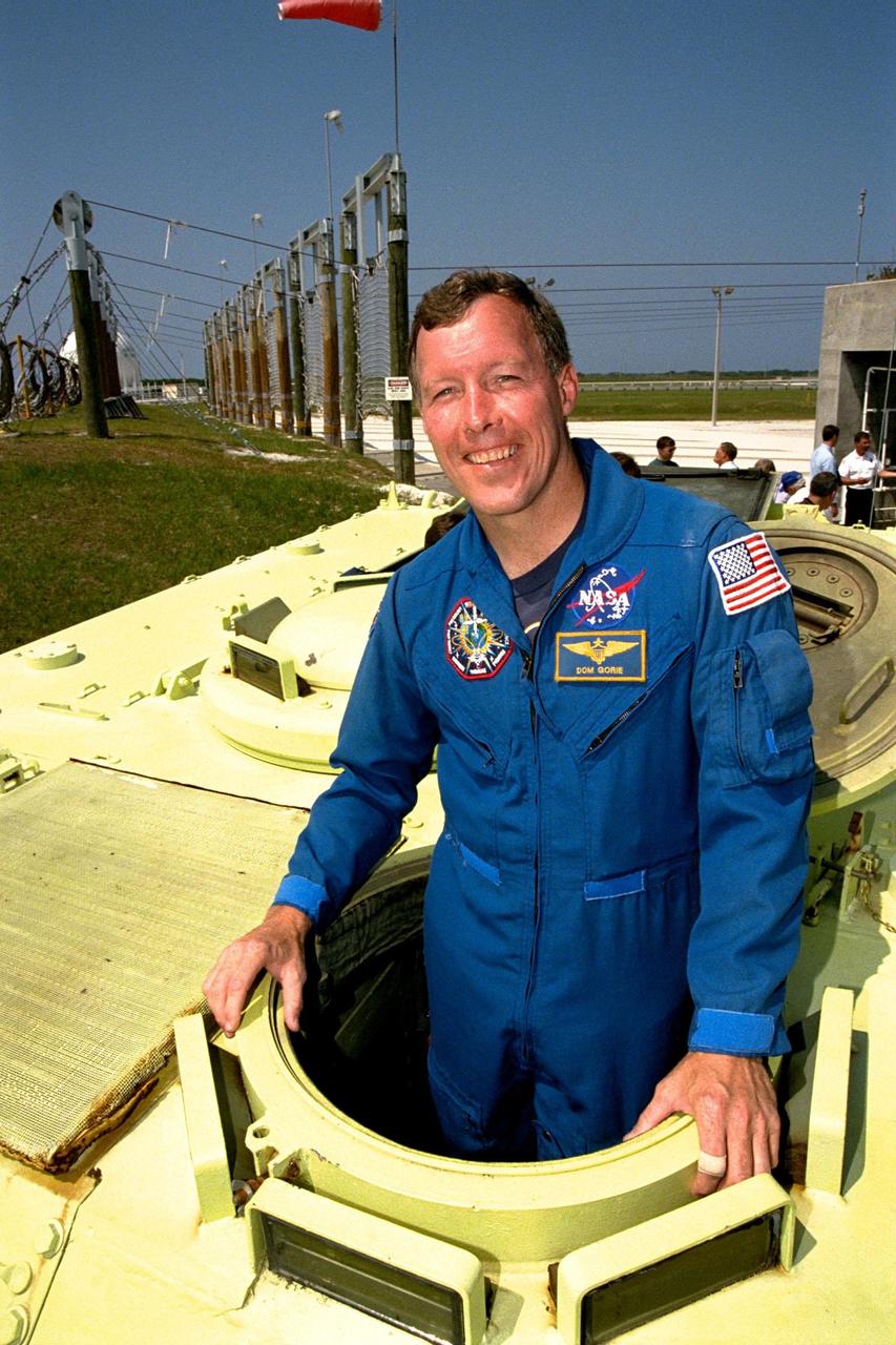 STS-91 Pilot Dominic Gorie is learning how to operate an M-113 armored personnel carrier during Terminal Countdown Demonstration Test (TCDT) training activities. The TCDT is held at KSC prior to each Space Shuttle flight to provide crews with an opportunity to participate in simulated countdown activities. STS-91 is scheduled to be launched on June 2 with a launch window opening around 6:10 p.m. EDT. The mission will feature the ninth Shuttle docking with the Russian Space Station Mir, the first Mir docking for Discovery, the conclusion of Phase I of the joint U.S.-Russian International Space Station Program, and the first flight of the new Space Shuttle super lightweight external tank. The STS-91 flight crew also includes Commander Charles Precourt and Mission Specialists Wendy B. Lawrence; Franklin Chang-Diaz, Ph.D.; Janet Kavandi, Ph.D.; and Valery Ryumin, with the Russian Space Agency. Andrew Thomas, Ph.D., will be returning to Earth with the crew after living more than four months aboard Mir