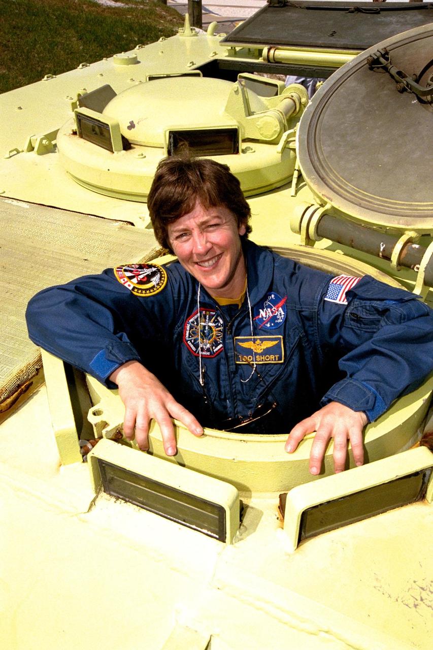 STS-91 Mission Specialist Wendy B. Lawrence is learning how to operate an M-113 armored personnel carrier during Terminal Countdown Demonstration Test (TCDT) training activities. The TCDT is held at KSC prior to each Space Shuttle flight to provide crews with an opportunity to participate in simulated countdown activities. STS-91 is scheduled to be launched on June 2 with a launch window opening around 6:10 p.m. EDT. The mission will feature the ninth Shuttle docking with the Russian Space Station Mir, the first Mir docking for Discovery, the conclusion of Phase I of the joint U.S.-Russian International Space Station Program, and the first flight of the new Space Shuttle super lightweight external tank. The STS-91 flight crew also includes Commander Charles Precourt; Pilot Dominic Gorie; and Mission Specialists Franklin Chang-Diaz, Ph.D.; Janet Kavandi, Ph.D.; and Valery Ryumin, with the Russian Space Agency. Andrew Thomas, Ph.D., will be returning to Earth with the crew after living more than four months aboard Mir