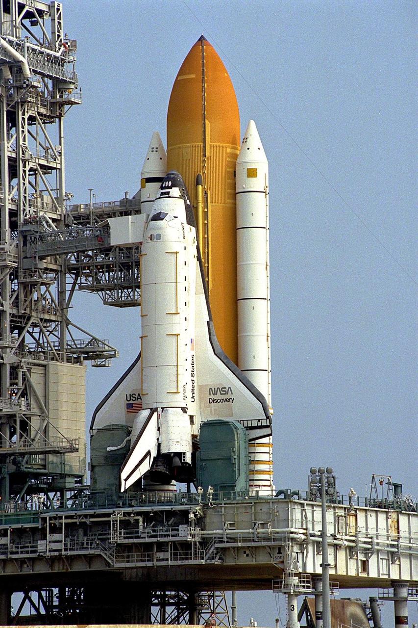 Preliminary reports indicate the Space Shuttle's first super lightweight external tank (SLWT) is in excellent condition following the completion of a tanking test yesterday during a simulated launch countdown at Launch Pad 39A. The pad's Rotating Service Structure will be closed around Discovery later today as preparations for the STS-91 launch on June 2 continue. The primary objectives of the test were to evaluate the strut loads between the tank and the solid rocket boosters and to verify the integrity of the new components of the tank. The SLWT is 7,500 pounds lighter than its predecessors and was developed to increase the Shuttle payload capacity on International Space Station assembly flights. Major changes to the lighter tank include the use of new materials and a revised internal design. The new liquid oxygen and liquid hydrogen tanks are constructed of aluminum lithium a lighter, stronger material than the metal alloy currently used. The redesigned walls of the liquid hydrogen tank were machined to provide additional strength and stability, as well. The STS-91 mission will also feature the ninth Shuttle docking with the Russian Space Station Mir, the first Mir docking for Discovery, and the conclusion of Phase I of the joint U.S.-Russian International Space Station Program