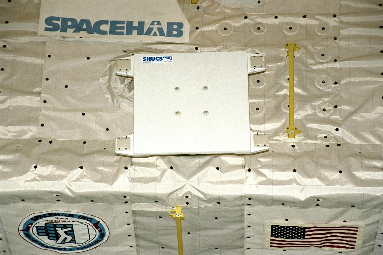 The SPACEHAB Single Module, is shown from the aft, with the SPACEHAB Universal Communication System (SHUCS) payload attached, in Discovery's payload bay shortly before the payload bay doors are closed for the flight of STS-91 at Launch Pad 39A. Launch is planned for June 2 with a window opening around 6:10 p.m. EDT. The single SPACEHAB module houses experiments to be performed by the astronauts and serves as a cargo carrier for items to be transferred to and from the Russian Space Station Mir. Flying for the first time, the SHUCS payload will be used to send and receive telephone voice and faxes, as well as provide video images of the crew from the SPACEHAB module, to test the improved availability of payload uplink and downlink communications with the ground. STS-91 will also feature the ninth Shuttle docking with the Russian Space Station Mir, the first Mir docking for Discovery, the conclusion of Phase I of the joint U.S.-Russian International Space Station Program, and the first flight of the new Space Shuttle super lightweight external tank. The STS-91 flight crew includes Commander Charles Precourt; Pilot Dominic Gorie; and Mission Specialists Wendy B. Lawrence; Franklin Chang-Diaz, Ph.D.; Janet Kavandi, Ph.D.; and Valery Ryumin, with the Russian Space Agency. Andrew Thomas, Ph.D., will be returning to Earth with the crew after living more than four months aboard Mir