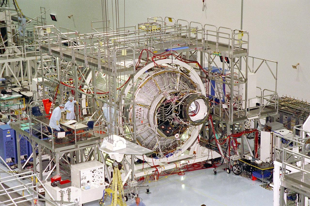 KENNEDY SPACE CENTER, FLA. -- The International Space Station's (ISS) Unity node, with Pressurized Mating Adapter (PMA)-2 attached, awaits further processing by Boeing technicians in its workstand in the Space Station Processing Facility (SSPF). The Unity node is the first element of the ISS to be manufactured in the United States and is currently scheduled to lift off aboard the Space Shuttle Endeavour on STS-88 later this year. Unity has two PMAs attached to it now that this mate is completed. PMAs are conical docking adapters which will allow the docking systems used by the Space Shuttle and by Russian modules to attach to the node's hatches and berthing mechanisms. Once in orbit, Unity, which has six hatches, will be mated with the already orbiting Control Module and will eventually provide attachment points for the U.S. laboratory module; Node 3; an early exterior framework or truss for the station; an airlock; and a multi-windowed cupola. The Control Module, or Functional Cargo Block, is a U.S.-funded and Russian-built component that will be launched aboard a Russian rocket from Kazakstan