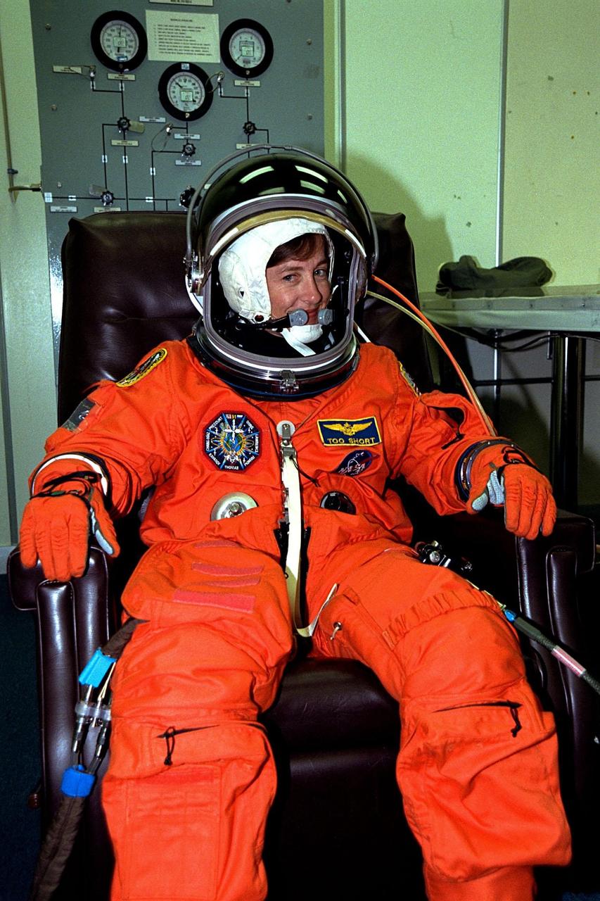 STS-91 Mission Specialist Wendy B. Lawrence is ready to go as her flight suit gets a final checkout in the Operations and Checkout (O&C) Building. The fitting takes place prior to the crew walkout and transport to Launch Pad 39A. She is a commander in the Navy and is on her third Shuttle mission and second trip to Mir. Lawrence has served as Director of Operations for NASA at the Gagarin Cosmonaut Training Center in Star City, Russia, and has also trained for a Shuttle-Mir flight. Lawrence will also on the flight deck during ascent and re-entry as flight engineer. In this capacity, she will be on-hand to support the commander and copilot in these critical parts of the flight. She will also have primary responsibility for all Shuttle-Mir transfer operations and science experiments in the middeck crew cabin area. STS-91 is scheduled to be launched on June 2 with a launch window opening around 6:10 p.m. EDT. The mission will feature the ninth and final Shuttle docking with the Russian space station Mir, the first Mir docking for Discovery, the first on-orbit test of the Alpha Magnetic Spectrometer (AMS), and the first flight of the new Space Shuttle super lightweight external tank. Astronaut Andrew S. W. Thomas will return to Earth as a STS91 crew member after living more than four months aboard Mir