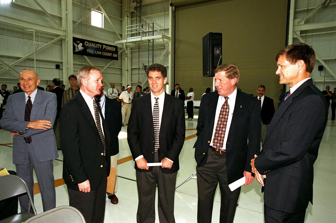 Participants in the ribbon cutting for KSC's new 34,600-square-foot Space Shuttle Main Engine Processing Facility (SSMEPF) gather to talk inside the facility following the ceremony. From left, they are Robert B. Sieck, director of Shuttle Processing; KSC Center Director Roy D. Bridges Jr.; U.S. Congressman Dave Weldon; John Plowden, vice president of Rocketdyne; and Donald R. McMonagle, manager of Launch Integration. A major addition to the existing Orbiter Processing Facility Bay 3, the SSMEPF replaces the Shuttle Main Engine Shop located in the Vehicle Assembly Building (VAB). The decision to move the shop out of the VAB was prompted by safety considerations and recent engine processing improvements. The first three main engines to be processed in the new facility will fly on Shuttle Endeavour's STS-88 mission in December 1998