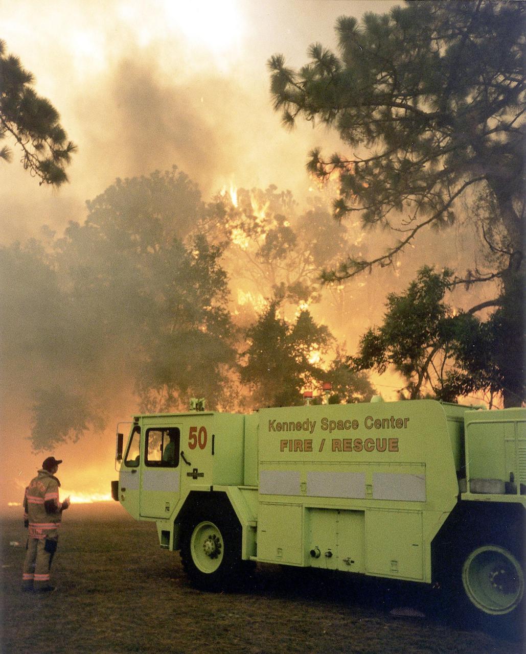 KENNEDY SPACE CENTER, FLA. -- Kennedy Space Center firefighters support firefighting efforts in north Brevard County with an aircraft rescue firefighting vehicle capable of holding 1,000 gallons of water.