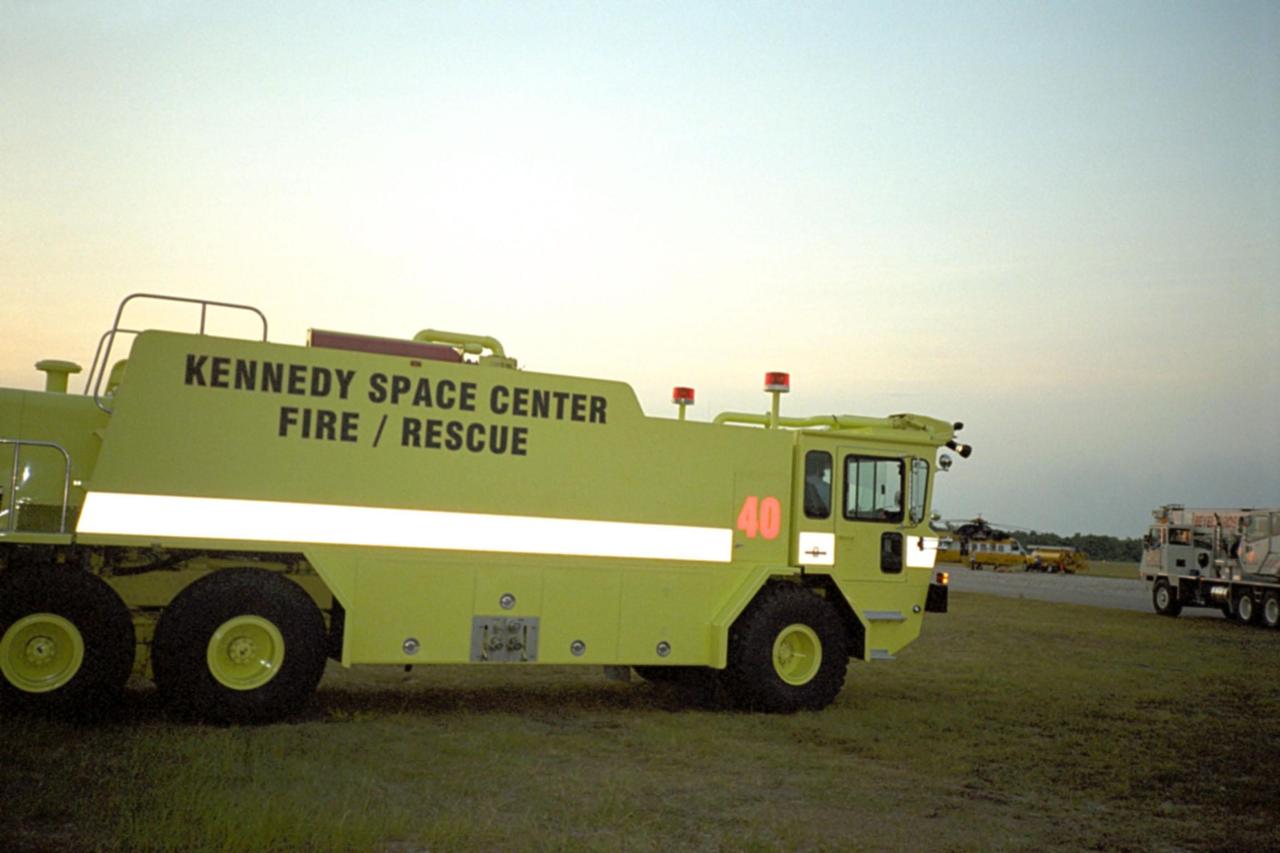 A Kennedy Space Center aircraft rescue firefighting vehicle supports heavy traffic at the Space Coast Regional Airport in Titusville, Florida, where aircraft capable of carrying water were staged during the recent brushfires throughout Florida. Aircraft were supporting firefighting efforts in Brevard, Volusia, and Flagler counties