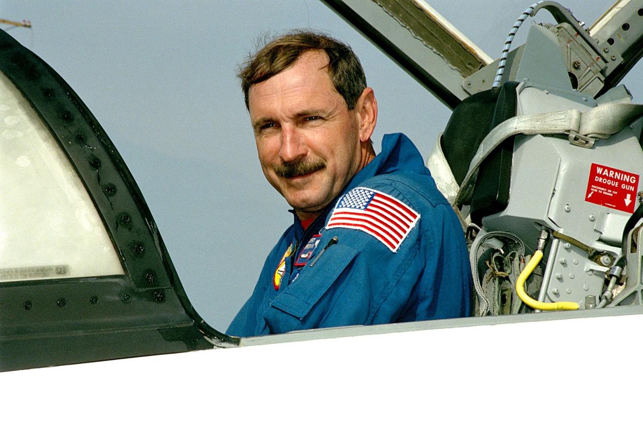 STS-95 Mission Commander Curtis L. Brown Jr. arrives aboard a T-38 jet aircraft at the Shuttle Landing Facility at KSC. The STS-95 crew is at KSC to look at the SPACEHAB module and the equipment that will fly with them on the Space Shuttle Discovery scheduled to launch Oct. 29, 1998. The mission includes research payloads such as the Spartan solar-observing deployable spacecraft, the Hubble Space Telescope Orbital Systems Test Platform, the International Extreme Ultraviolet Hitchhiker, as well as the SPACEHAB single module with experiments on space flight and the aging process
