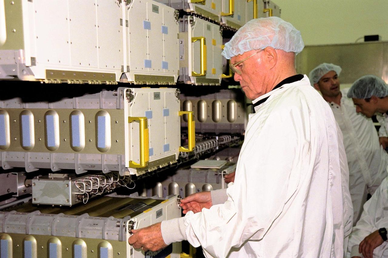 STS-95 Payload Specialist John H. Glenn Jr., who also is a senator from Ohio, works with equipment inside the SPACEHAB module at the SPACEHAB Payload Processing Facility in Cape Canaveral. STS-95 will feature a variety of research payloads, including the Spartan solar-observing deployable spacecraft, the Hubble Space Telescope Orbital Systems Platform, the International Extreme Ultraviolet Hitchhiker, and experiments on space flight and the aging process. STS-95 is targeted for an Oct. 29 launch aboard the Space Shuttle Discovery