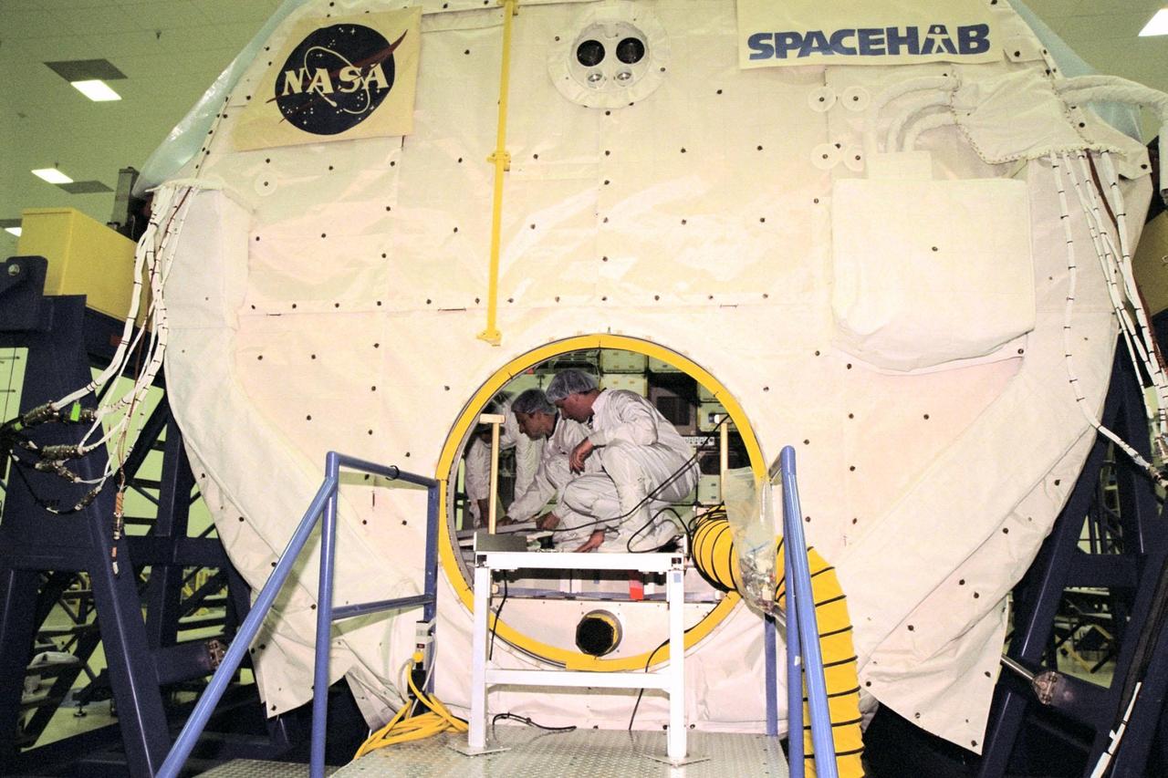 KENNEDY SPACE CENTER, FLA. -- Members of the STS-95 crew familiarize themselves with equipment inside the SPACEHAB module at the SPACEHAB Payload Processing Facility in Cape Canaveral. STS-95 will feature a variety of research payloads, including the Spartan solar-observing deployable spacecraft, the Hubble Space Telescope Orbital Systems Platform, the International Extreme Ultraviolet Hitchhiker, and experiments on space flight and the aging process. STS-95 is targeted for an Oct. 29 launch aboard the Space Shuttle Discovery