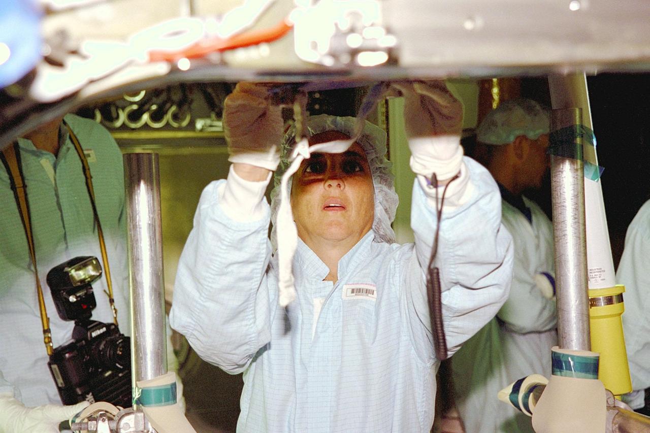 KENNEDY SPACE CENTER, FLA. -- STS-88 Mission Specialist Nancy J. Currie works on a foot restraint attached to the Unity connecting module, part of the International Space Station, in the Space Station Processing Facility at KSC. During the mission, the Unity connecting module will be mated to the Zarya control module, which will already be in orbit. The STS-88 crew is participating in a Crew Equipment Interface Test, which gives astronauts an opportunity for a hands-on look at the payloads on which they will be working while on orbit. STS-88 will be the first Space Shuttle launch for the International Space Station. Launch is scheduled for December 1998