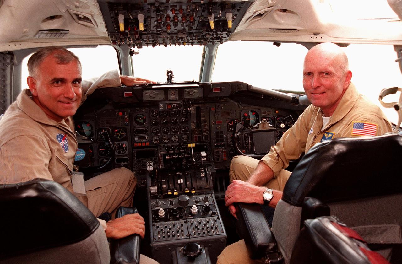 NASA pilots Dick Ewens and Gordon Fullerton sit at the controls in the cockpit of the Dryden Flight Research Center DC-8 that was on view at Patrick Air Force Base. The DC-8 is one of two aircraft being flown in a hurricane study through September to learn about the storms from top to bottom. Flying at 35,000 to 40,000 feet, the DC-8 is equipped with instruments to measure a hurricane’s structure, environment and changes in intensity and tracking. The other plane, a modified U2, and the DC-8 will fly in conjunction with scheduled storm flights of the National Oceanic and Atmospheric Administration (NOAA) out of MacDill Air Force Base in Tampa and the U.S. Air Force 53rd Weather Reconnaissance Squadron from Keesler Air Force Base, Miss. The study is part of NASA’s Earth Science enterprise to better understand the total Earth system and the effects of natural and human-induced changes on the global environment
