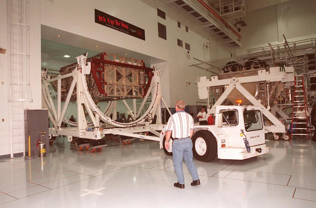An Integrated Equipment Assembly (IEA) is moved from the low bay into the high bay at the Space Station Processing Facility at KSC. The IEA, a large truss segment of the International Space Station (ISS), is one of four power modules to be used on the ISS. The modules contain batteries for the ISS solar panels and power for the life support systems and experiments that will be conducted. This first IEA will fly on the Space Shuttle Endeavour as part of STS-97, scheduled to launch August 5, 1999