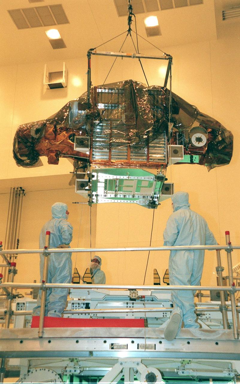 The Spartan solar-observing deployable spacecraft is moved onto a workstand in the Multi-Payload Processing Facility at KSC. Spartan is one of the payloads for the STS-95 mission, scheduled to launch Oct. 29. Other research payloads include the Hubble Space Telescope Orbital Systems Test Platform, the International Extreme Ultraviolet Hitchhiker, as well as the SPACEHAB single module with experiments on space flight and the aging process