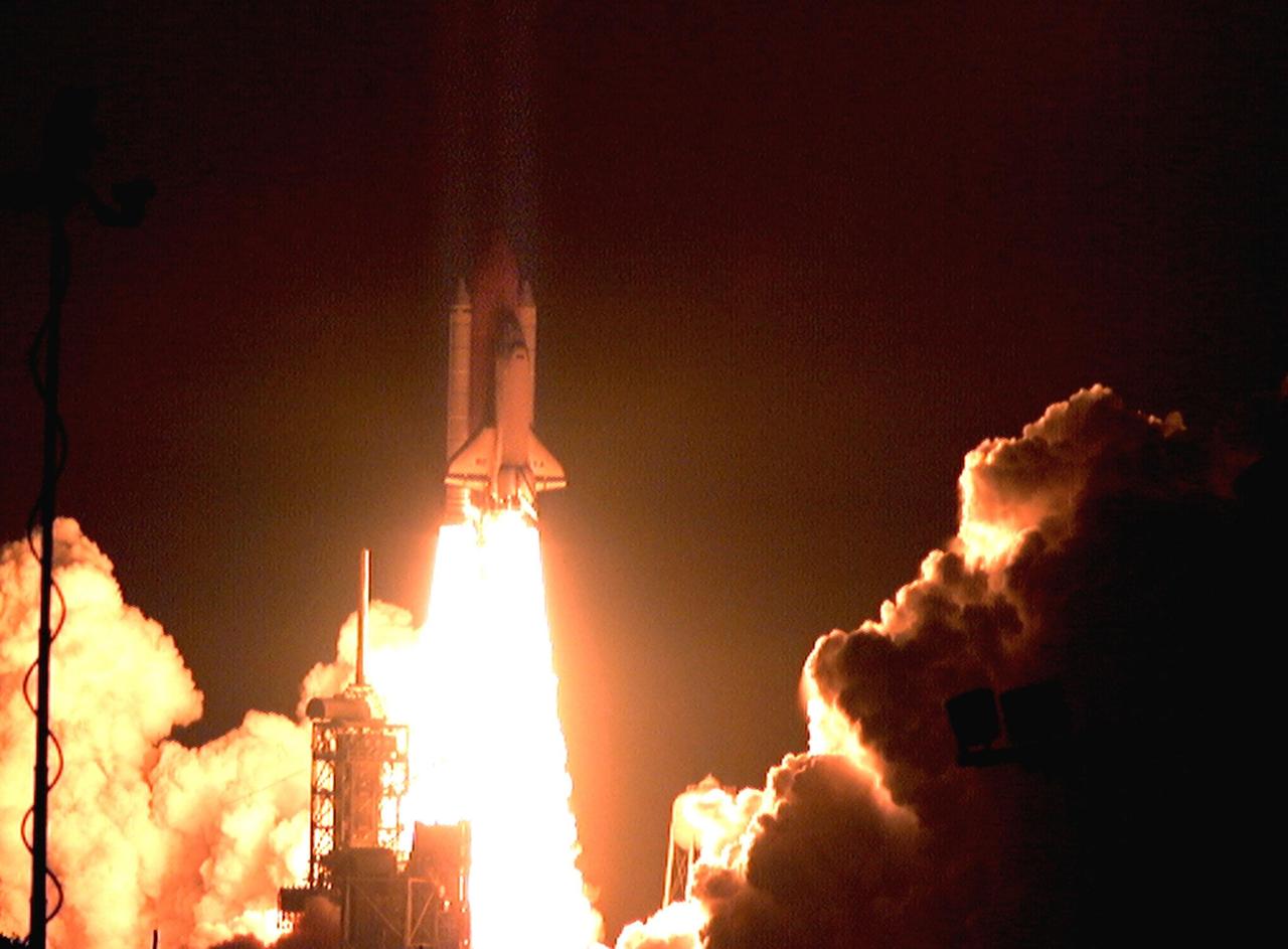 With a stream of fire chasing it, Space Shuttle Columbia shoots through the night sky on its successful liftoff from Launch Pad 39-B on mission STS-93. Liftoff occurred at 12:31 a.m. EDT. STS-93 is a five-day mission primarily to release the Chandra X-ray Observatory, which will allow scientists from around the world to study some of the most distant, powerful and dynamic objects in the universe. The crew numbers five: Commander Eileen M. Collins, Pilot Jeffrey S. Ashby, and Mission Specialists Stephen A. Hawley (Ph.D.), Catherine G. Coleman (Ph.D.) and Michel Tognini of France, with the Centre National d'Etudes Spatiales (CNES). Collins is the first woman to serve as commander of a Shuttle mission. The target landing date is July 27, 1999, at 11:20 p.m. EDT