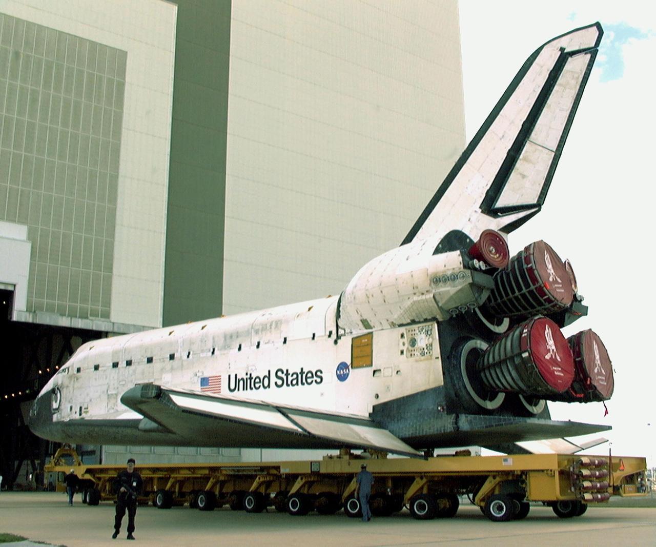 KENNEDY SPACE CENTER, FLA. -- Orbiter Discovery begins rolling into the Vehicle Assembly Building for stacking with an external tank and solid rocket boosters for its launch on mission STS-103. The launch date is currently under review for early December. STS-103, the third Hubble Space Telescope servicing mission, is a "call-up" due to the need to replace portions of the pointing system, the gyros, which have begun to fail on the Hubble Space Telescope. Although Hubble is operating normally and conducting its scientific observations, only three of its six gyroscopes are working properly. The gyroscopes allow the telescope to point at stars, galaxies and planets. The STS-103 crew will also be replacing a Fine Guidance Sensor and an older computer with a new enhanced model, an older data tape recorder with a solid-state digital recorder, a failed spare transmitter with a new one, and degraded insulation on the telescope with new thermal insulation. The crew will also install a Battery Voltage/Temperature Improvement Kit to protect the spacecraft batteries from overcharging and overheating when the telescope goes into a safe mode