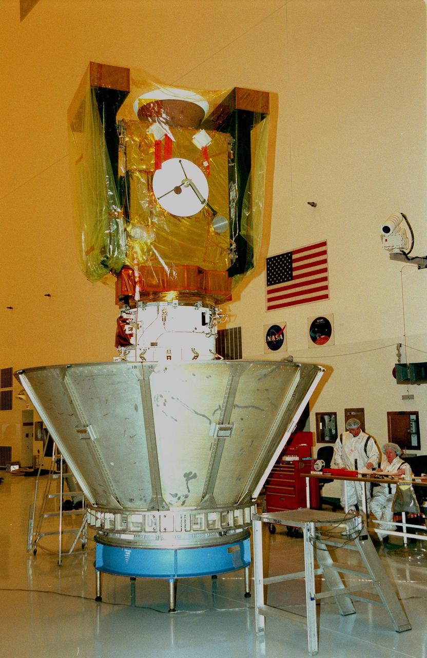 In the Payload Hazardous Servicing Facility, the Stardust spacecraft waits to be encased in a protective canister for its move to Launch Pad 17-A, Cape Canaveral Air Station, for launch preparations. Stardust is targeted for liftoff on Feb. 6 aboard a Boeing Delta II rocket for a close encounter with the comet Wild 2 in January 2004. Using a silicon-based substance called aerogel, Stardust will capture comet particles flying off the nucleus of the comet. The spacecraft also will bring back samples of interstellar dust. These materials consist of ancient pre-solar interstellar grains and other remnants left over from the formation of the solar system. Scientists expect their analysis to provide important insights into the evolution of the sun and planets and possibly into the origin of life itself. The collected samples will return to Earth in a sample return capsule to be jettisoned as Stardust swings by Earth in January 2006
