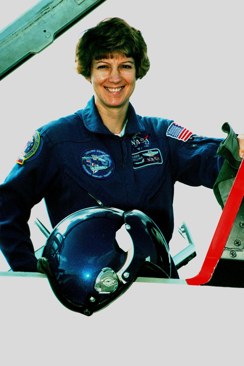Before leaving KSC, STS-93 Commander Eileen M. Collins poses by a T-38 jet trainer aircraft at the Shuttle Landing Facility. She and the rest of the STS-93 crew spent two days visiting mission-related sites, including the Vertical Processing Facility where the Chandra X-ray Observatory is undergoing testing. STS-93 is scheduled to launch July 9 aboard Space Shuttle Columbia and has the primary mission of the deployment of the observatory. Formerly called the Advanced X-ray Astrophysics Facility, Chandra comprises three major elements: the spacecraft, the science instrument module (SIM), and the world's most powerful X-ray telescope. Chandra will allow scientists from around the world to see previously invisible black holes and high-temperature gas clouds, giving the observatory the potential to rewrite the books on the structure and evolution of our universe. Collins is the first woman to serve as commander of a Space Shuttle. Other STS-93 crew members are Pilot Jeffrey S. Ashby and Mission Specialists Catherine G. Coleman, Steven A. Hawley, and Michel Tognini of France, who represents the Centre National d'Etudes Spatiales (CNES)