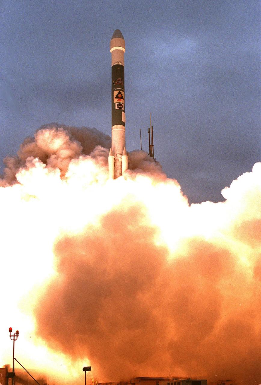 KENNEDY SPACE CENTER, FLA. -- A Boeing Delta II expendable launch vehicle lifts off with NASA's Mars Polar Lander into a cloud-covered sky at 3:21:10 p.m. EST from Launch Complex 17B, Cape Canaveral Air Station. The lander is a solar-powered spacecraft designed to touch down on the Martian surface near the northern-most boundary of the south polar cap, which consists of carbon dioxide ice. The lander will study the polar water cycle, frosts, water vapor, condensates and dust in the Martian atmosphere. It is equipped with a robotic arm to dig beneath the layered terrain at the polar cap. In addition, Deep Space 2 microprobes, developed by NASA's New Millennium Program, are installed on the lander's cruise stage. After crashing into the planet's surface, they will conduct two days of soil and water experiments up to 1 meter (3 feet) below the Martian surface, testing new technologies for future planetary descent probes. The lander is the second spacecraft to be launched in a pair of Mars Surveyor '98 missions. The first is the Mars Climate Orbiter, which was launched aboard a Delta II rocket from Launch Complex 17A on Dec. 11, 1998.