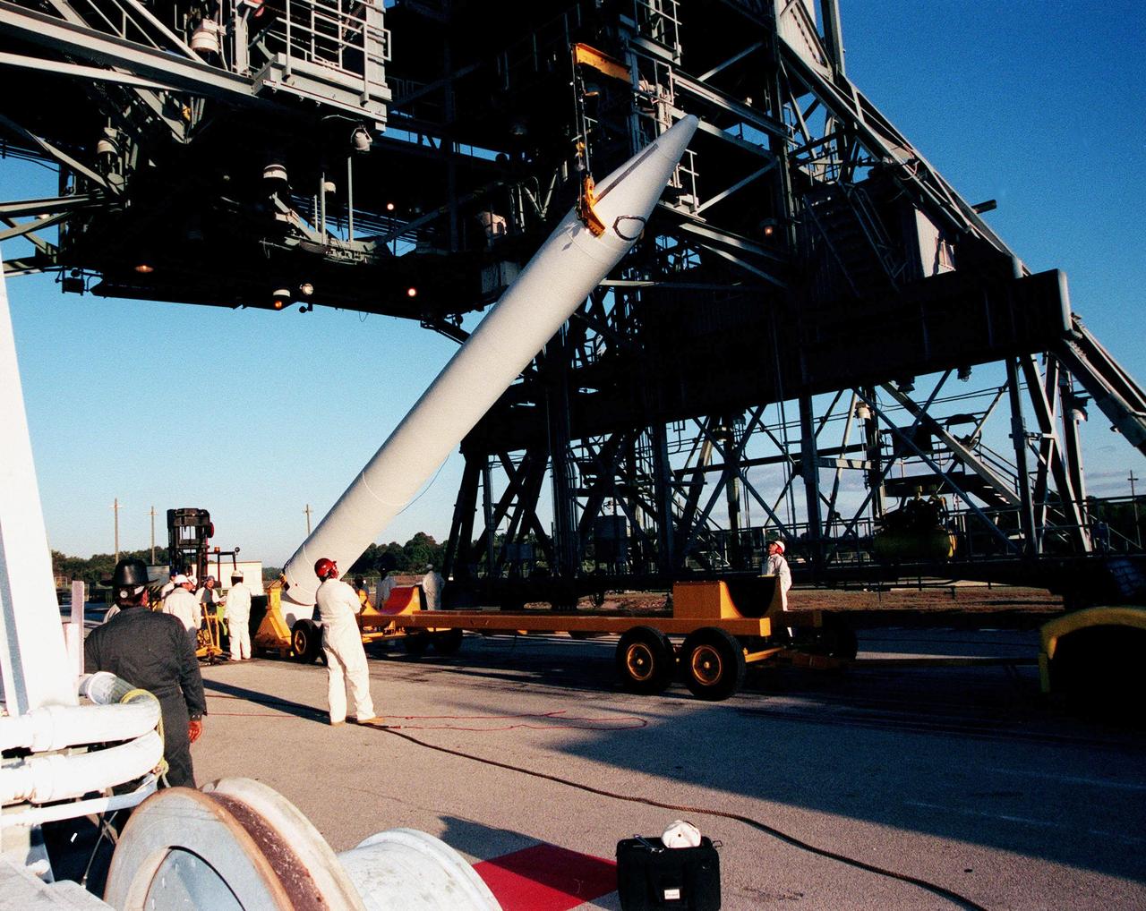 A fourth and final Solid Rocket Booster arrives at Pad 17A, Cape Canaveral Air Station to be mated with a Boeing Delta II rocket. The rocket will carry the Stardust satellite into space for a close encounter with the comet Wild 2 in January 2004. Using a medium called aerogel, Stardust will capture comet particles flying off the nucleus of the comet, plus collect interstellar dust for later analysis. The collected samples will return to Earth in a Sample Return Capsule to be jettisoned as Stardust swings by Earth in January 2006. Stardust is scheduled to be launched on Feb. 6, 1999