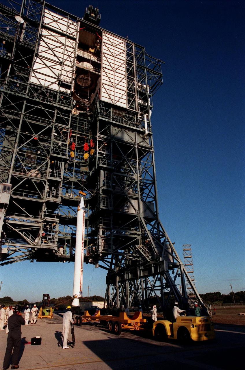 A fourth and final Solid Rocket Booster, to be mated with a Boeing Delta II rocket, starts its lift up the tower at Pad 17A, Cape Canaveral Air Station. The rocket will carry the Stardust satellite into space for a close encounter with the comet Wild 2 in January 2004. Using a medium called aerogel, Stardust will capture comet particles flying off the nucleus of the comet, plus collect interstellar dust for later analysis. The collected samples will return to Earth in a Sample Return Capsule to be jettisoned as Stardust swings by Earth in January 2006. Stardust is scheduled to be launched on Feb. 6, 1999