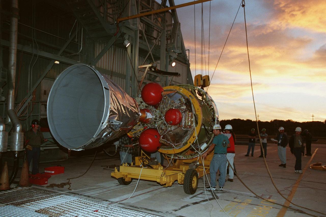 At Pad 17A, Cape Canaveral Air Station, the second stage of a Boeing Delta II rocket arrives for mating with the first stage. The rocket is targeted for launch on Feb. 6, carrying the <a href="http://www-pao.ksc.nasa.gov/kscpao/captions/subjects/stardust.htm">Stardust </a> spacecraft into space for a close encounter with the comet Wild 2 in January 2004. Using a substance called aerogel, Stardust will capture comet particles flying off the nucleus of the comet, plus collect interstellar dust for later analysis. The collected samples will return to Earth in a sample return capsule to be jettisoned as Stardust swings by Earth in January 2006