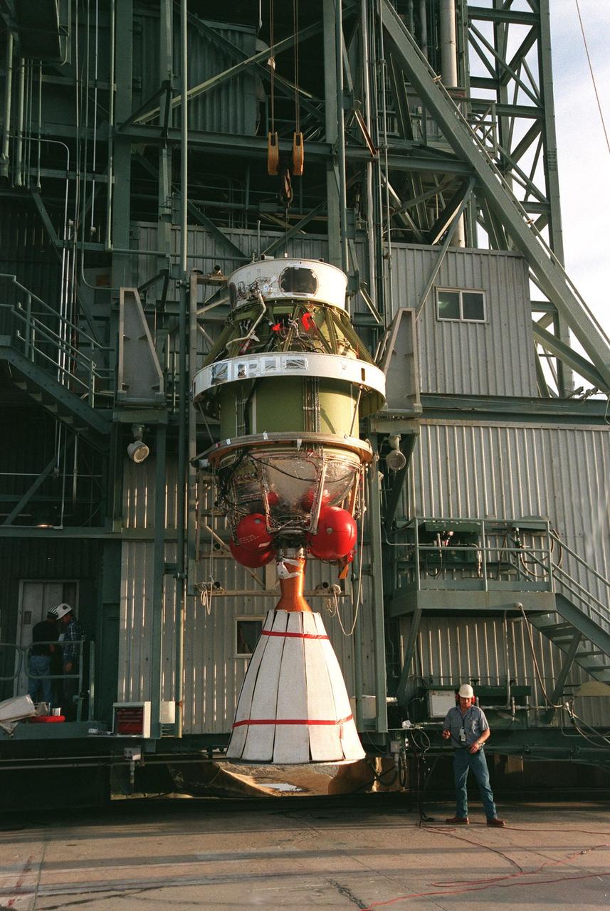 The second stage of a Boeing Delta II rocket begins its move up the tower at Pad 17A, Cape Canaveral Air Station, for mating with the first stage. The rocket is targeted for launch on Feb. 6, carrying the <a href="http://www-pao.ksc.nasa.gov/kscpao/captions/subjects/stardust.htm">Stardust </a> spacecraft into space for a close encounter with the comet Wild 2 in January 2004. Using a substance called aerogel, Stardust will capture comet particles flying off the nucleus of the comet, plus collect interstellar dust for later analysis. The collected samples will return to Earth in a sample return capsule to be jettisoned as Stardust swings by Earth in January 2006