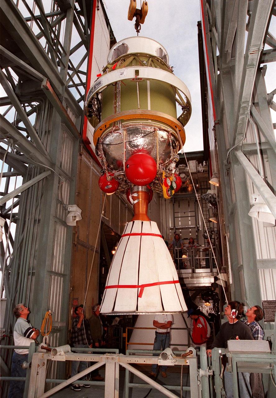The second stage of a Boeing Delta II rocket arrives at the top of the tower at Pad 17A, Cape Canaveral Air Station for mating with the first stage. The rocket is targeted for launch on Feb. 6, carrying the <a href="http://www-pao.ksc.nasa.gov/kscpao/captions/subjects/stardust.htm">Stardust </a>spacecraft into space for a close encounter with the comet Wild 2 in January 2004. Using a substance called aerogel, Stardust will capture comet particles flying off the nucleus of the comet, plus collect interstellar dust for later analysis. The collected samples will return to Earth in a sample return capsule to be jettisoned as Stardust swings by Earth in January 2006
