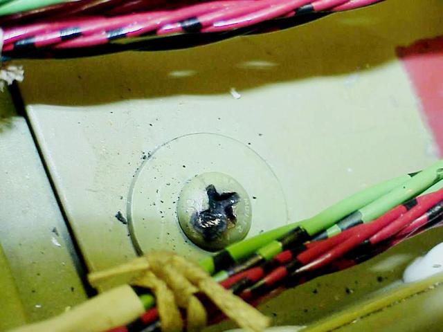 KENNEDY SPACE CENTER, FLA. -- In the orbiter Columbia's payload bay, the head of a screw (shown here) is identified as the probable cause of damage to a wire that caused a short circuit in two separate main engine controllers during launch of mission STS-93. As a result of the findings of electrical wiring inspections, Shuttle program managers have decided to inspect the wiring in Endeavour's payload bay before its next mission, STS-99. The inspection and possible repair work will lead to a delayed launch date no earlier than Oct.7. The primary payload of the mission is the Shuttle Radar Topography Mission, a specially modified radar system that will gather data for the most accurate and complete topographic map of the Earth's surface that has ever been assembled