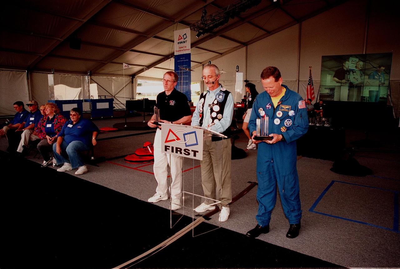 Kicking off the award ceremony at the 1999 FIRST Southeastern Regional robotic competition held at KSC are David Brown, Executive Director of FIRST; Woody Flowers, national advisor for FIRST; and astronaut David Brown. FIRST is a nonprofit organization, For Inspiration and Recognition of Science and Technology, that sponsors the event pitting gladiator robots against each other in an athletic-style competition. The FIRST robotics competition is designed to provide students with a hands-on, inside look at engineering and other professional careers, pairing high school students with engineer mentors and corporations. The regional event comprised 27 teams. Along with the championship award, which went to high school teams in Miami and San German, Puerto Rico, 15 other awards were presented
