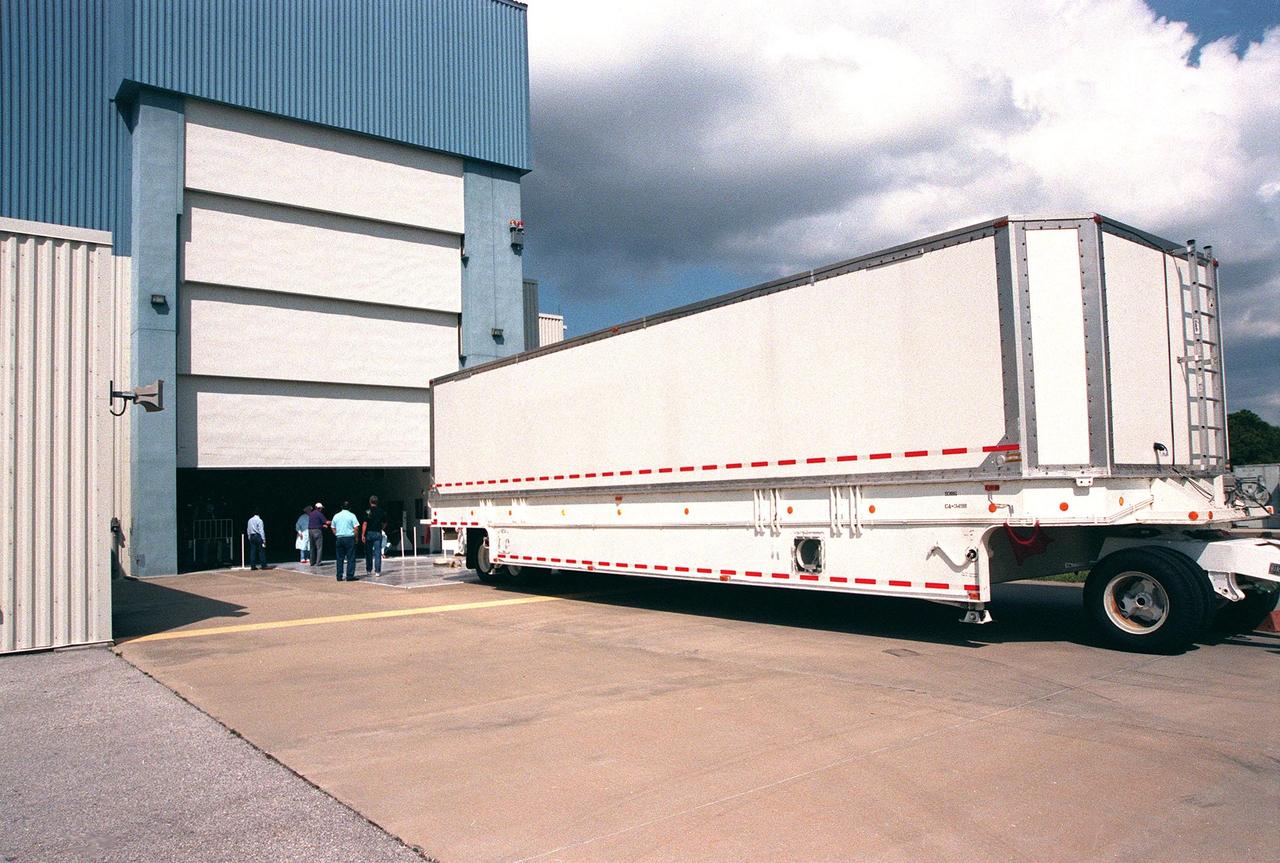 The vehicle carrying the Shuttle Radar Topography Mission (SRTM) arrives at the Multi-Payload Processing Facility. The primary payload on mission STS-99, the SRTM consists of a specially modified radar system that will fly onboard the Space Shuttle during the 11-day mission scheduled for September 1999. This radar system will gather data that will result in the most accurate and complete topographic map of the Earth's surface that has ever been assembled. SRTM is an international project spearheaded by the National Imagery and Mapping Agency and NASA, with participation of the German Aerospace Center DLR. Its objective is to obtain the most complete high-resolution digital topographic database of the Earth