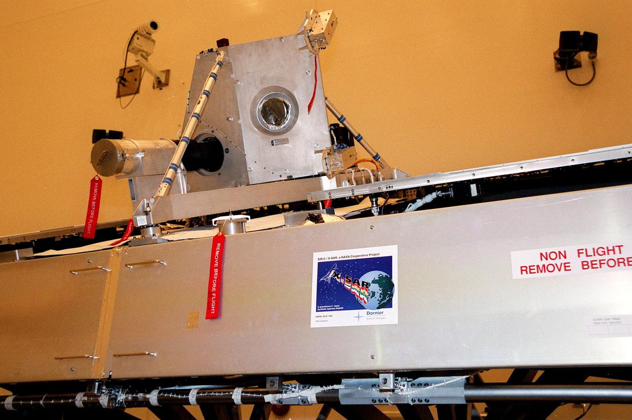 The Shuttle Radar Topography Mission (SRTM) sits uncovered inside the Multi-Payload Processing Facility. The primary payload on mission STS-99, the SRTM consists of a specially modified radar system that will fly onboard the Space Shuttle during the 11-day mission scheduled for September 1999. This radar system will gather data that will result in the most accurate and complete topographic map of the Earth's surface that has ever been assembled. SRTM is an international project spearheaded by the National Imagery and Mapping Agency and NASA, with participation of the German Aerospace Center DLR. Its objective is to obtain the most complete high-resolution digital topographic database of the Earth